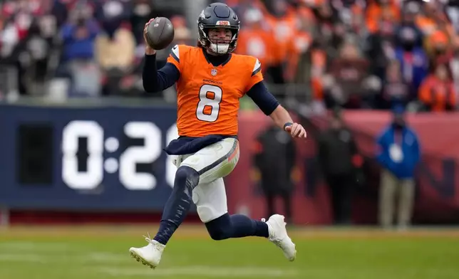 Denver Broncos quarterback Jarrett Stidham New England Patriots during the first the half of the AFC Championship NFL football game, Sunday, Jan. 25, 2026, in Denver. (AP Photo/John Locher)