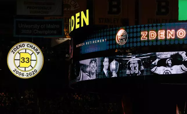 Former Boston Bruins captain Zdeno Chara's number "33" is raised to the rafters at TD Garden before an NHL hockey game between the Boston Bruins and the Seattle Kraken Thursday, Jan. 15, 2026, in Boston. (AP Photo/Winslow Townson)