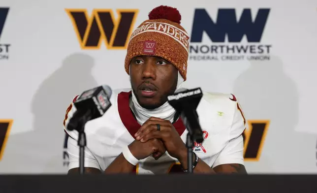 Washington Commanders quarterback Josh Johnson speaks during a news conference following an NFL football game against the Dallas Cowboys Thursday, Dec. 25, 2025, in Landover, Md. (AP Photo/Nick Wass)