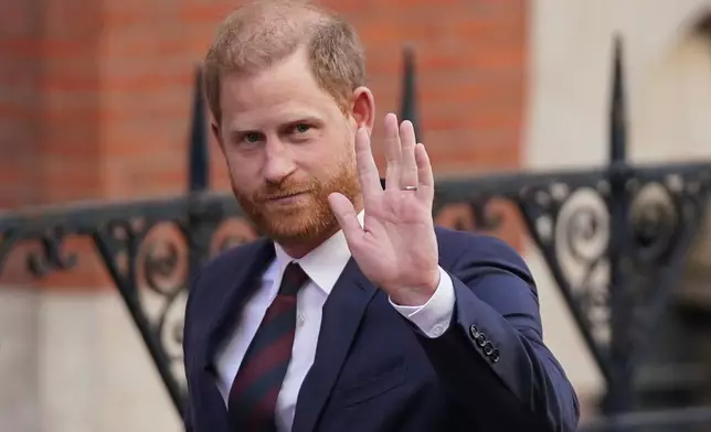 FILE - Prince Harry waves as he leaves the Royal Courts of Justice in London, Wednesday, April 9, 2025. (AP Photo/Alberto Pezzali, File)