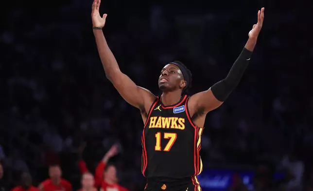 Atlanta Hawks forward Onyeka Okongwu reacts after scoring a 3-point basket during first half of an NBA basketball game against the New York Knicks, Friday, Jan. 2, 2026, in New York. (AP Photo/Heather Khalifa)