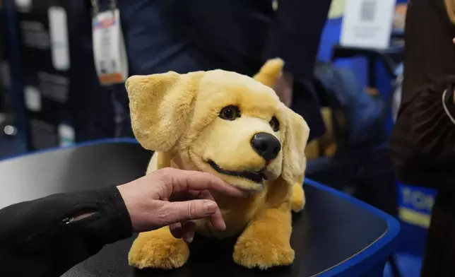 A Tombot robotic puppy is pictured at a Tombot booth during the CES Unveiled tech show Sunday, Jan. 4, 2026, in Las Vegas. (AP Photo/Abbie Parr)