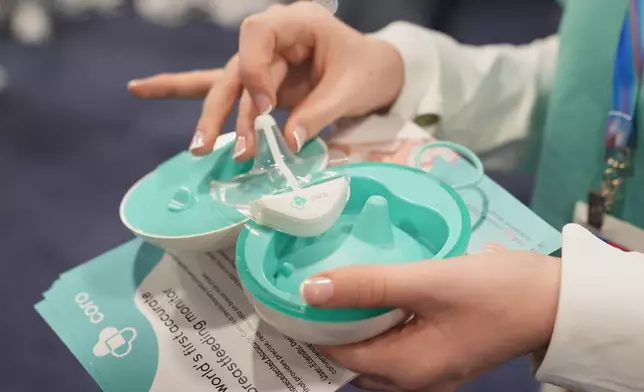 A Coro breastfeeding monitor is pictured at a Coroflo booth during the CES Unveiled tech show Sunday, Jan. 4, 2026, in Las Vegas. (AP Photo/Abbie Parr)