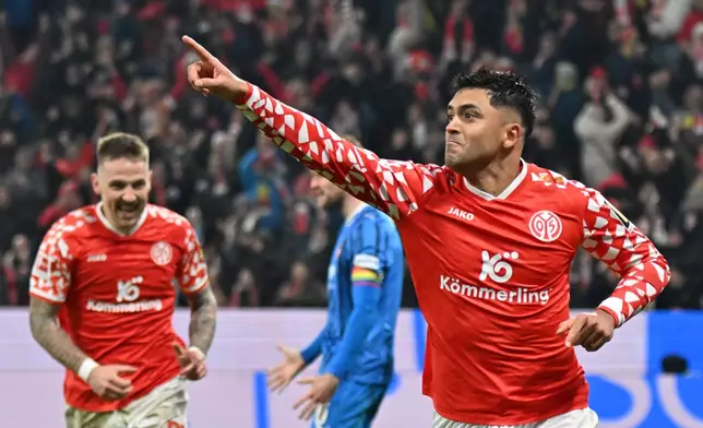Mainz's Nadiem Amiri celebrates scoring during the Bundesliga soccer match between FSV Mainz 05 andFC Heidenheim in Mainz, Germany, Tuesday Jan. 13, 2026. (Torsten Silz/dpa via AP)