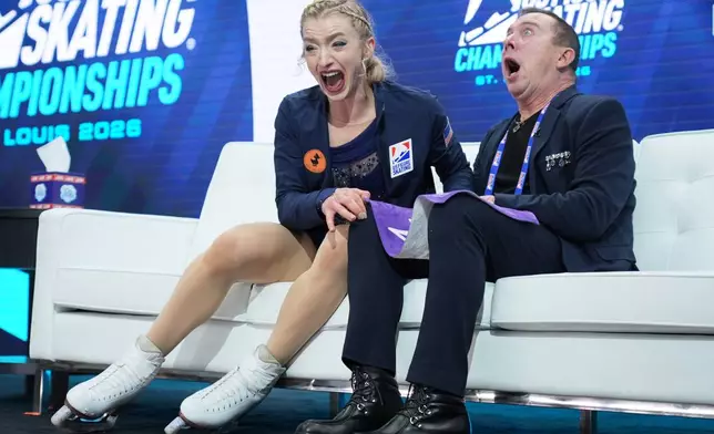Amber Glenn reacts to seeing her scores after competing during the women's free skating competition at the U.S. Figure Skating Championships, Friday, Jan. 9, 2026, in St. Louis. (AP Photo/Stephanie Scarbrough)