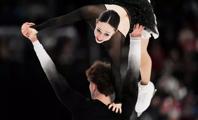 Katie McBeath and Daniil Parkman compete during the pairs free skating competition at the U.S. Figure Skating Championships, Friday, Jan. 9, 2026, in St. Louis. (AP Photo/Jeff Roberson)