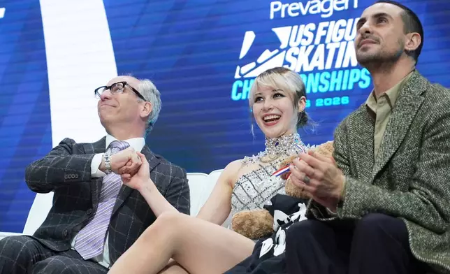 Alysa Liu waits for her scores after competing during the women's free skating competition at the U.S. Figure Skating Championships, Friday, Jan. 9, 2026, in St. Louis. (AP Photo/Stephanie Scarbrough)