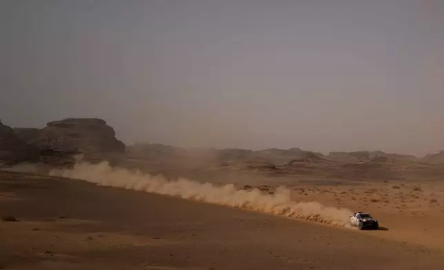 Driver Ronan Chabot and co-driver Gilles Pillot compete during the third stage of the Dakar Rally with a start and finish in Alula, Saudi Arabia, Tuesday, Jan. 6, 2026. (AP Photo/Thibault Camus)