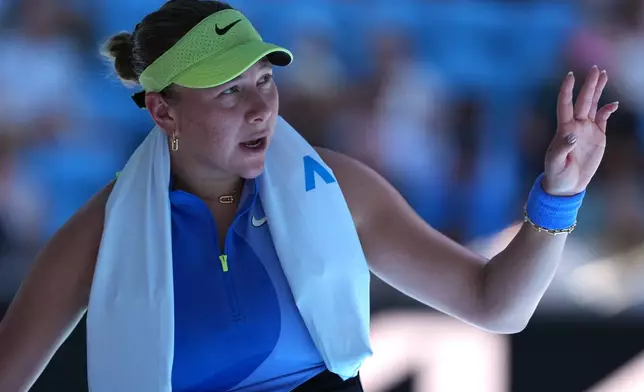 Amanda Anisimova of the U.S. gestures during her third round match against compatriot Peyton Stearns at the Australian Open tennis championship in Melbourne, Australia, Saturday, Jan. 24, 2026. (AP Photo/Aaron Favila)