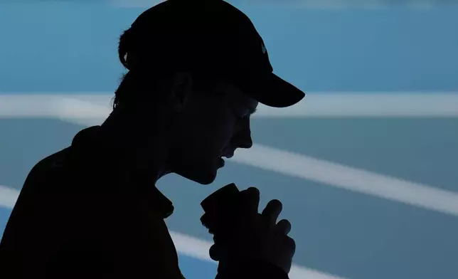 Jannik Sinner of Italy takes a drink during his third round match against Eliot Spizzirri of the U.S. at the Australian Open tennis championship in Melbourne, Australia, Saturday, Jan. 24, 2026. (AP Photo/Dita Alangkara)