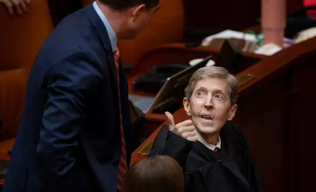 Rep. Clinton Okerlund, R-Sandy, left, speaks with Chief Justice Matthew Durrant prior to Justice Durrant delivering the State of the Judiciary address on the first day of the 2026 legislative session in Salt Lake City, on Tuesday, Jan. 20, 2026. (The Deseret News via AP)