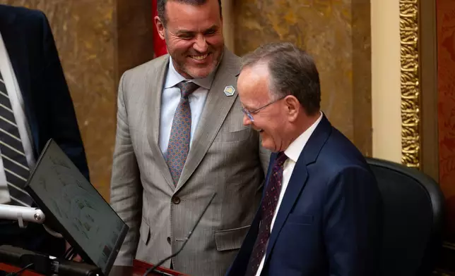 House Speaker Mike Schultz, R-Hooper, left, and Senate President Stuart Adams, R-Layton, share a laugh prior to listening to Chief Justice Matthew Durrant delivering the State of the Judiciary address on the first day of the 2026 legislative session in Salt Lake City, on Tuesday, Jan. 20, 2026. (The Deseret News via AP)