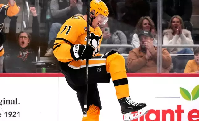 Pittsburgh Penguins' Evgeni Malkin celebrates his goal during the second period of an NHL hockey game against the New Jersey Devils in Pittsburgh, Thursday, Jan. 8, 2026. (AP Photo/Gene J. Puskar)