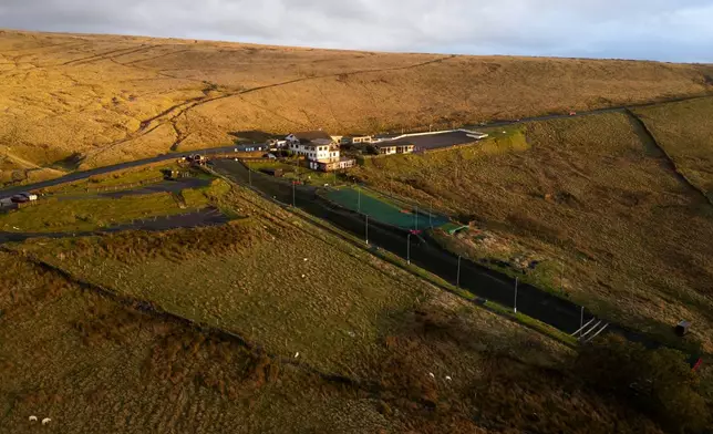 An aerial view of Pendle Ski Club before an inter-club ski meeting at the dry ski slope in Clitheroe, England, Tuesday, Oct. 28, 2025. (AP Photo/Jon Super).