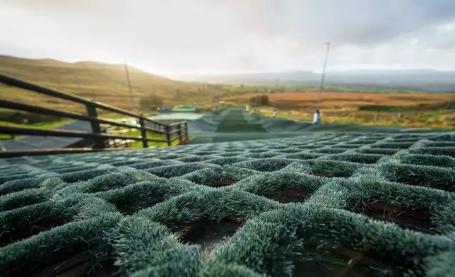 A close-up of the surface of the track of the Pendle Ski Club racing track before an inter-club ski meeting at the dry ski slope in Clitheroe, England, Tuesday, Oct. 28, 2025. (AP Photo/Jon Super).
