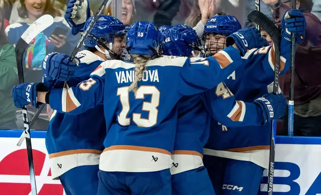 Vancouver Goldeneyes' Sarah Nurse (20) celebrates her goal against the Toronto Sceptres with her teammates during the third period of a PWHL hockey game in Vancouver, British Columbia, Thursday, Jan. 22, 2026. (Ethan Cairns/The Canadian Press via AP)