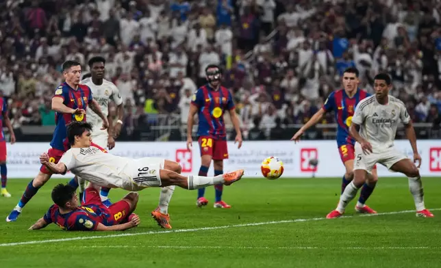 Real Madrid's Gonzalo Garcia scores against FC Barcelona during the Spanish Super Cup final soccer match at King Abdullah Sports City Stadium in Jeddah, Saudi Arabia, Sunday, Jan. 11, 2026. (AP Photo/Altaf Qadri)