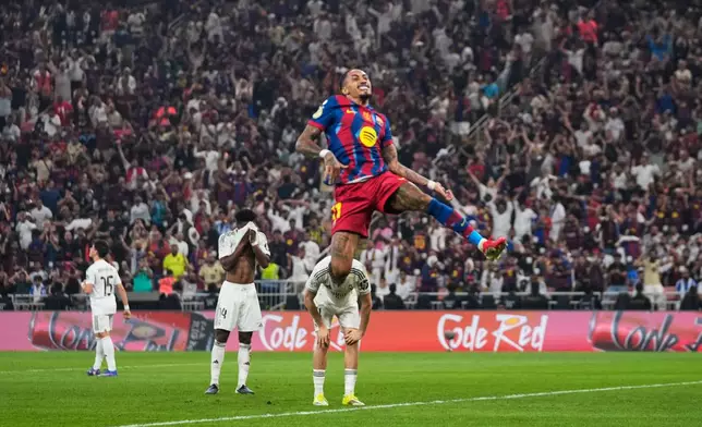 Barcelona's Raphinha celebrates after scoring his second goal during the Spanish Super Cup final soccer match against Real Madrid at King Abdullah Sports City Stadium in Jeddah, Saudi Arabia, Sunday, Jan. 11, 2026. (AP Photo/Altaf Qadri)