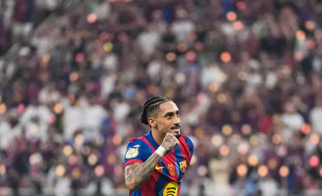 Barcelona's Raphinha celebrates after scoring his second goal during the Spanish Super Cup final soccer match against Real Madrid at King Abdullah Sports City Stadium in Jeddah, Saudi Arabia, Sunday, Jan. 11, 2026. (AP Photo/Altaf Qadri)