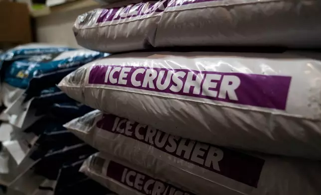 FILE - Ice Crusher, a calcium chloride blend road salt, is displayed for sale at Ankeny Hardware, Jan. 11, 2024, in Portland, Ore. (AP Photo/Jenny Kane, File)