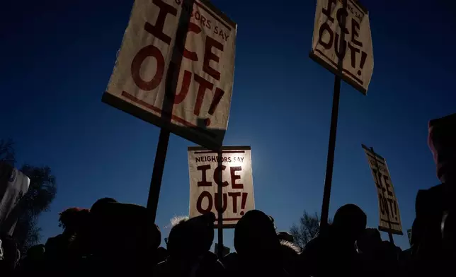 Protesters gather in front of the Minnesota State Capitol in response to the death of Renee Good, who was fatally shot by an ICE officer last week, Wednesday, Jan. 14, 2026, in St. Paul, Minn. (AP Photo/John Locher)