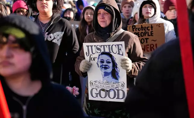 Protesters gather in front of the Minnesota State Capitol in response to the death of Renee Good, who was fatally shot by an ICE officer last week, Wednesday, Jan. 14, 2026, in St. Paul, Minn. (AP Photo/John Locher)