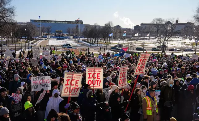 Hundreds of protesters gather in front of the Minnesota State Capitol in response to the death of Renee Good, who was fatally shot by an ICE officer last week, Wednesday, Jan. 14, 2026, in St. Paul, Minn. (AP Photo/John Locher)