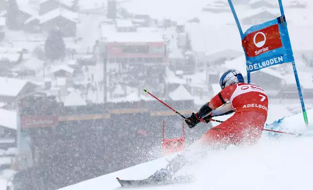 Switzerland's Marco Odermatt speeds down the course on his way to win an alpine ski, men's World Cup giant slalom, in Adelboden, Switzerland, Saturday, Jan. 10, 2026. (AP Photo/Gabriele Facciotti)