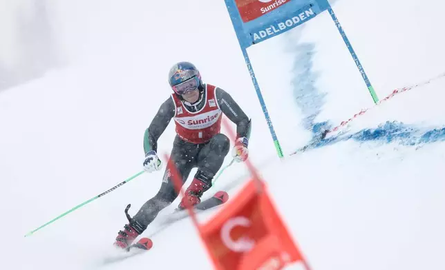 Brazil's Lucas Pinheiro Braathen speeds down the course during an alpine ski, men's World Cup giant slalom, in Adelboden, Switzerland, Saturday, Jan. 10, 2026. (AP Photo/Gabriele Facciotti)