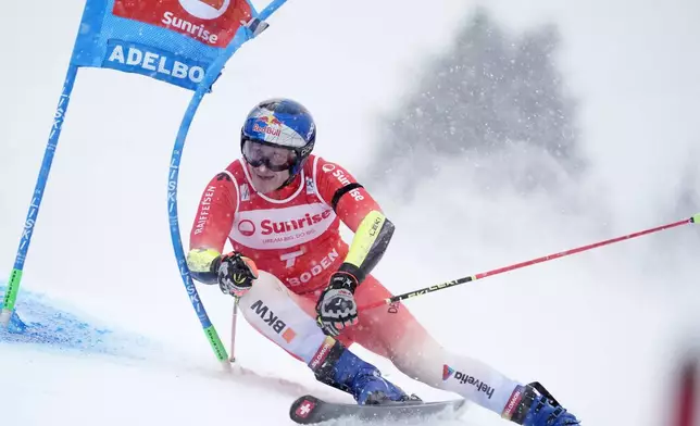 Switzerland's Marco Odermatt speeds down the course during an alpine ski, men's World Cup giant slalom, in Adelboden, Switzerland, Saturday, Jan. 10, 2026. (AP Photo/Giovanni Zenoni)