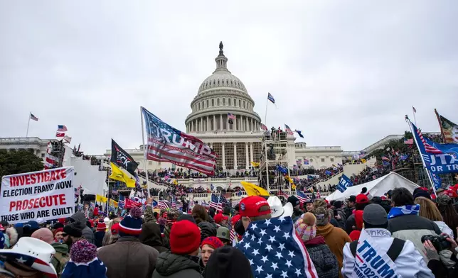 FILE - Rioters loyal to President Donald Trump rally at the U.S. Capitol in Washington, Jan. 6, 2021. (AP Photo/Jose Luis Magana, File)