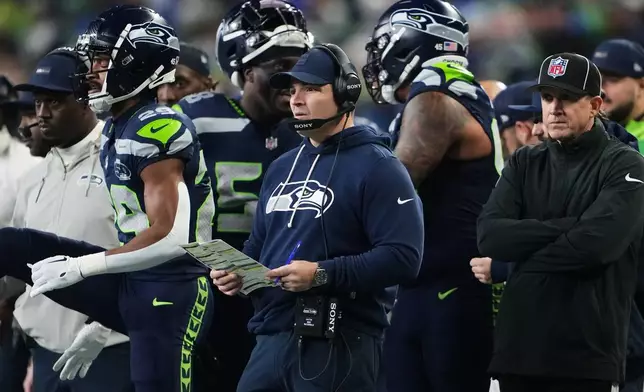 Seattle Seahawks head coach Mike Macdonald watches from the sideline during the first half of an NFL football divisional playoff game against the San Francisco 49ers, Saturday, Jan. 17, 2026, in Seattle. (AP Photo/Lindsey Wasson)