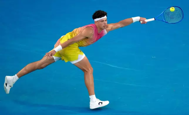 FILE - Ben Shelton of the U.S. plays a forehand return to Jannik Sinner of Italy during their semifinal match at the Australian Open tennis championship in Melbourne, Australia, Jan. 24, 2025. (AP Photo/Manish Swarup, File)