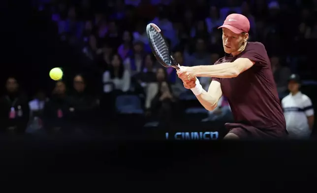 Italy's Jannik Sinner hits a backhand to Spain's Carlos Alcaraz during an exhibition tennis match in Incheon, South Korea, Saturday, Jan. 10, 2026. (Shin Jun-hee/Yonhap via AP)