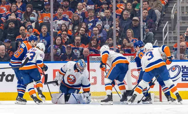 New York Islanders' Ilya Sorokin (30) makes a save the against Edmonton Oilers during the third period of an NHL hockey game in Edmonton, Alberta, Thursday, Jan. 15, 2026. (Timothy Matwey/The Canadian Press via AP)
