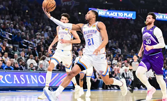 Oklahoma City Thunder guard Aaron Wiggins (21) pass the ball against the Utah Jazz during the first half of an NBA basketball game, Wenesday, Jan. 7, 2025, in Oklahoma City. (AP Photo/Gerald Leong)