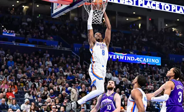 Oklahoma City Thunder guard/forward Jalen Williams (8) drives the ball against the Utah Jazz during the first half of an NBA basketball game, Wednesday, Jan. 7, 2025, in Oklahoma City. (AP Photo/Gerald Leong)