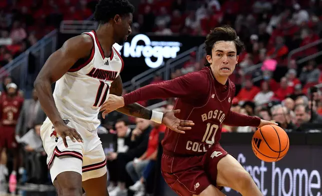 Boston College guard Luka Toews (10) attempts to drive past Louisville guard Kobe Rodgers (11) during the first half of an NCAA college basketball game in Louisville, Ky., Saturday, Jan. 10, 2026. (AP Photo/Timothy D. Easley)