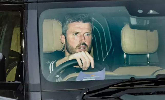 Michael Carrick arrives at Manchester United's Trafford Training Centre, Carrington, England, Tuesday, Jan. 13, 2026. (Danny Lawson/PA via AP)