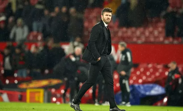 FILE - Manchester United's temporary coach Michael Carrick walks off the pitch at the end of the English Premier League soccer match between Manchester United and Arsenal at Old Trafford stadium in Manchester, England, Thursday, Dec. 2, 2021. (AP Photo/Dave Thompson, File)