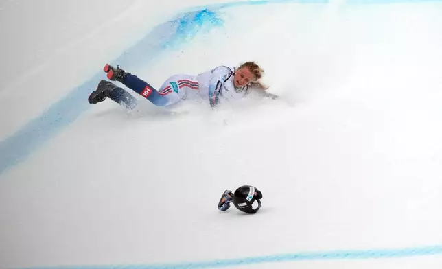 Norway's Marte Monsen crashes during an alpine ski, women's World Cup downhill, in Crans Montana , Switzerland, Friday, Jan. 30, 2026. (AP Photo/Giovanni Auletta)