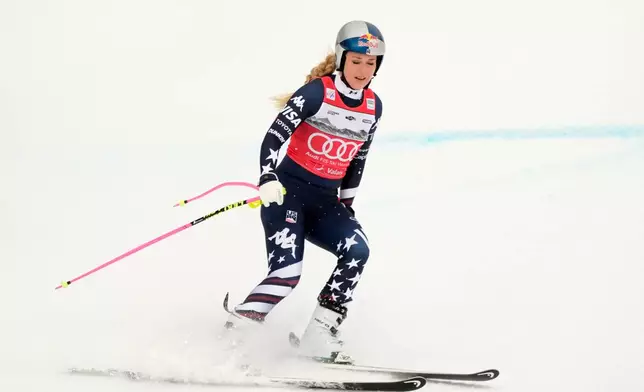 United States' Lindsey Vonn at the finish line after crashing, during an alpine ski, women's World Cup downhill, in Crans Montana , Switzerland, Friday, Jan. 30, 2026. (AP Photo/Giovanni Auletta)
