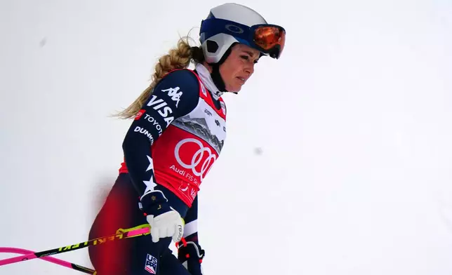 United States' Lindsey Vonn at the finish line after crashing, during an alpine ski, women's World Cup downhill, in Crans Montana , Switzerland, Friday, Jan. 30, 2026. (AP Photo/Pier Marco Tacca)
