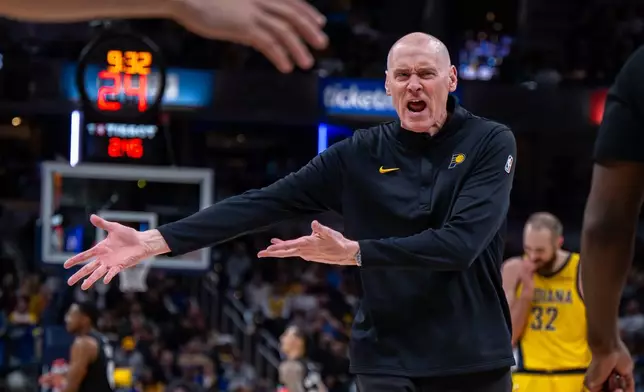 Indiana Pacers head coach Rick Carlisle reacts toward an official during the second half of an NBA basketball game against San Antonio Spurs in Indianapolis, Friday, Jan. 2, 2026. Carlisle was called for a technical foul after the outburst. (AP Photo/Doug McSchooler)