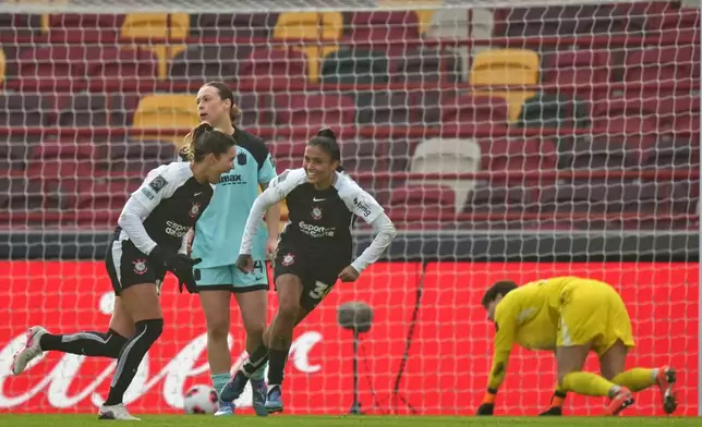 Corinthian's Gabi Zanotti, left, celebrates after scoring the opening goal during the Women's Champions Cup semifinal soccer match between Gotham FC and Corinthians in London, Wednesday, Jan. 28, 2026. (AP Photo/Alastair Grant)