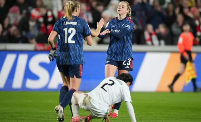 Arsenal's Alessia Russo, right, celebrates after scoring her side's fifth goal during the Women's Champions Cup semifinal soccer match between Arsenal and Asfar in London, Wednesday, Jan. 28, 2026. (AP Photo/Alastair Grant)