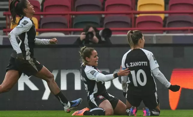 Corinthian's Gabi Zanotti, right, celebrates after scoring the opening goal during the Women's Champions Cup semifinal soccer match between Gotham FC and Corinthians in London, Wednesday, Jan. 28, 2026. (AP Photo/Alastair Grant)