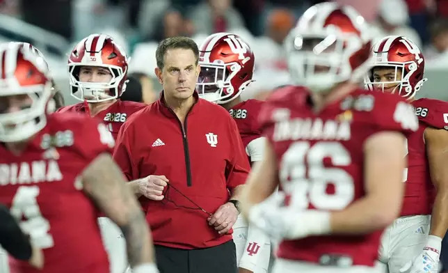Indiana head coach Curt Cignetti watches during warm ups before the College Football Playoff national championship game between Miami and Indiana, Monday, Jan. 19, 2026, in Miami Gardens, Fla. (AP Photo/Rebecca Blackwell)