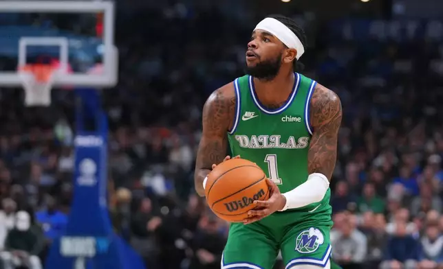Dallas Mavericks guard Jaden Hardy prepares to shoot a basket against the Brooklyn Nets during the first half of an NBA basketball game Monday, Jan. 12, 2026, in Dallas. (AP Photo/Julio Cortez)