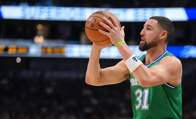 Dallas Mavericks guard Klay Thompson shoots a basket against the Brooklyn Nets during the first half of an NBA basketball game Monday, Jan. 12, 2026, in Dallas. (AP Photo/Julio Cortez)